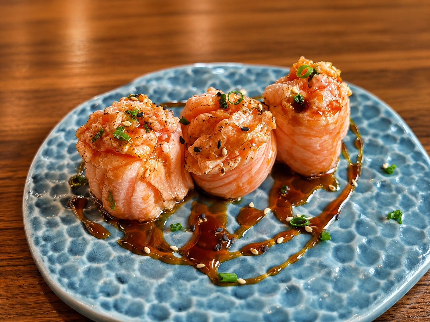 Salmon rose sushi with sesame and sauce